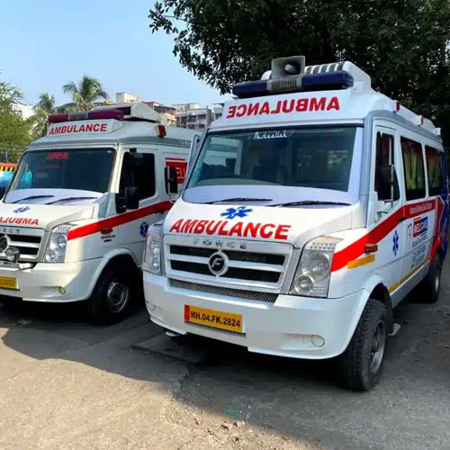 Two white and red emergency ambulances parked side-by-side.