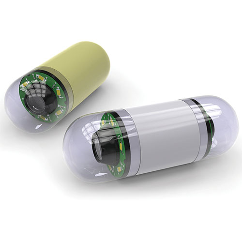 Two high-tech capsule devices; one green and one gray, each partially transparent, revealing internal electronic components.