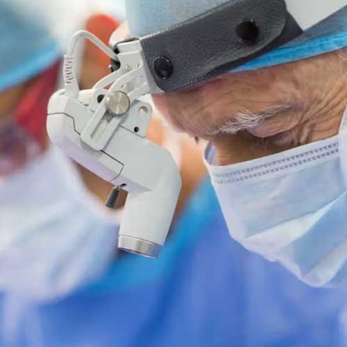 A close-up of a surgical microscope, showcasing its intricate parts and equipment in a medical environment.